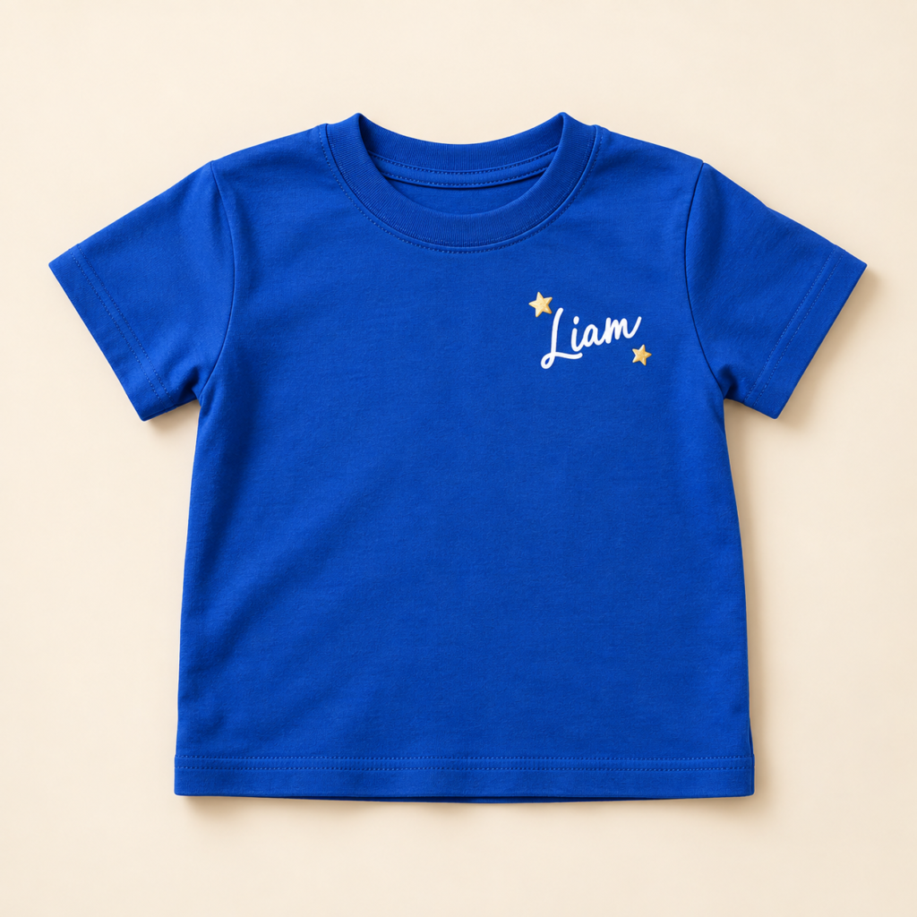 Personalized royal blue toddler T-shirt with a custom name and gold stars